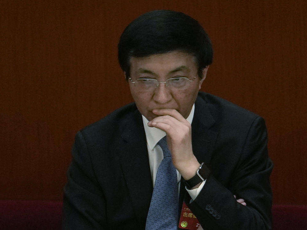 Politburo Standing Committee member Wang Huning attends a session of China's National People's Congress at the Great Hall of the People in Beijing, Tuesday, March 7, 2023.