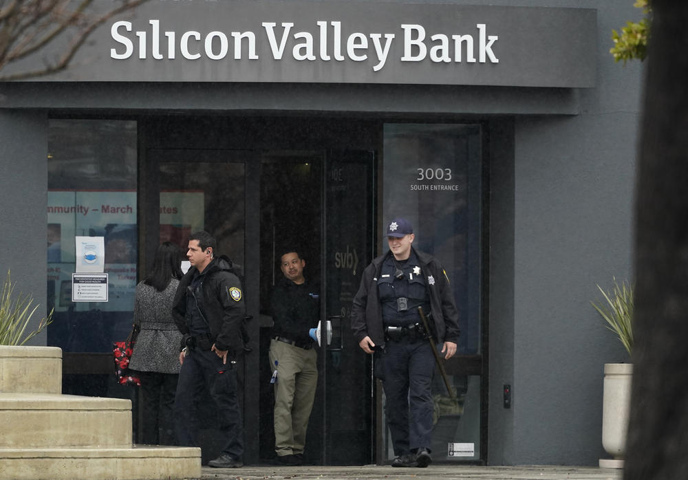 Santa Clara Police officers exit Silicon Valley Bank in Santa Clara, Calif., Friday, March 10, 2023. The Federal Deposit Insurance Corporation was seizing the assets of Silicon Valley Bank, marking the largest bank failure since Washington Mutual during the height of the 2008 financial crisis.