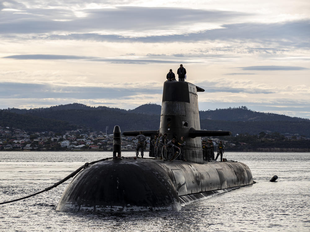 A Royal Australian Navy submarine arrives at a logistics port visit on April 1, 2021 in Hobart, Australia. New nuclear-powered submarines will eventually replace them.