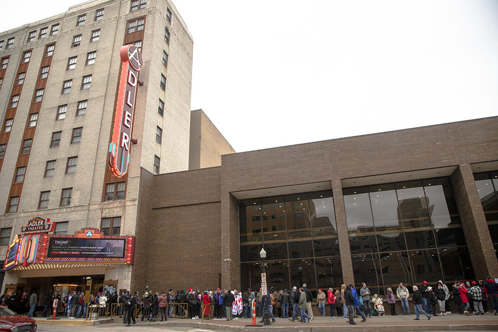 Trump supporters line up outside the Adler Theater in downtown Davenport, Iowa, on Monday to see the former president speak at his first Iowa event since announcing his third presidential bid.
