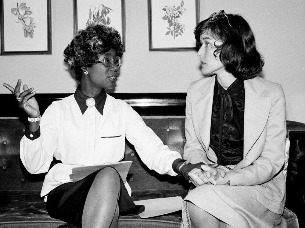 Congresswomen Shirley Chisholm, D-N.Y., left, and Pat Schroeder, D-Colo., are pictured at a news conference in Washington on July 31, 1979.