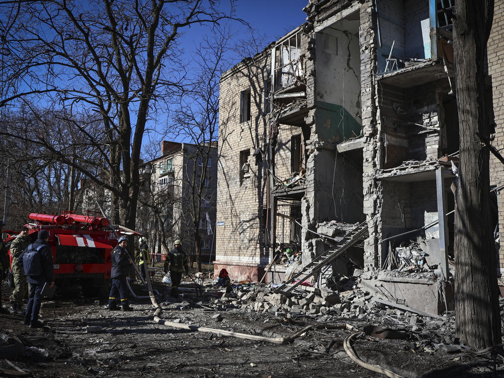 Ukrainian Emergency Service rescuers work on a building damaged by shelling in Kramatorsk, Ukraine, on Tuesday. The attack happened hours before a Russian fighter jet collided with a U.S. drone over the Black Sea.