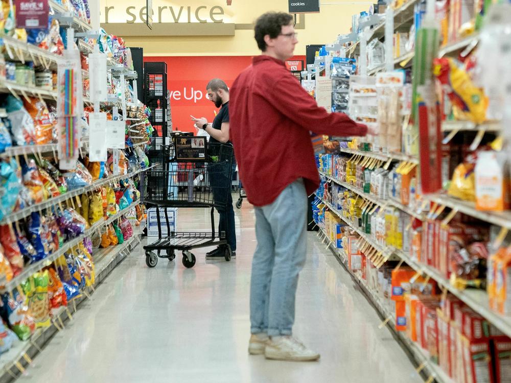 Shoppers browse at a grocery store in Washington, D.C. Retail sales dipped in February after surging in the previous month.