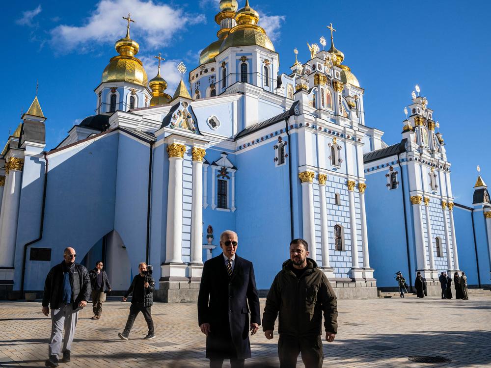 President Biden and Ukrainian President Volodymyr Zelenskyy walk in front of St. Michaels cathedral in Kyiv on Feb. 20. during a surprise visit ahead of the anniversary of Russia's war in Ukraine.