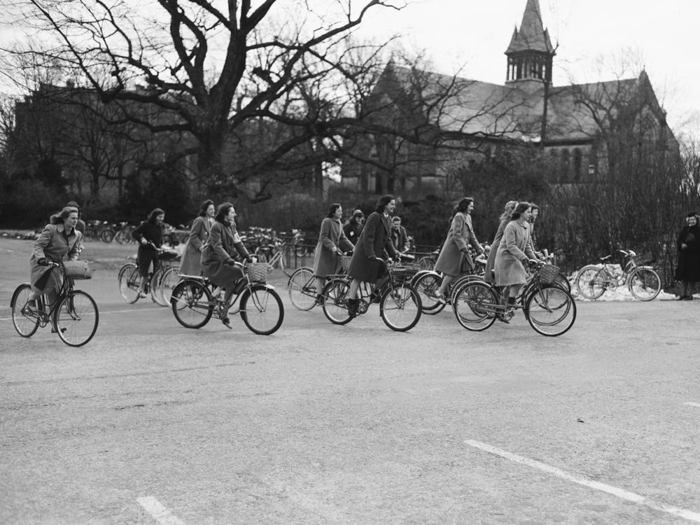 Wellesley College students bike across campus in 1942. The school now accepts applications from trans women, but not trans men, and only certain nonbinary people.