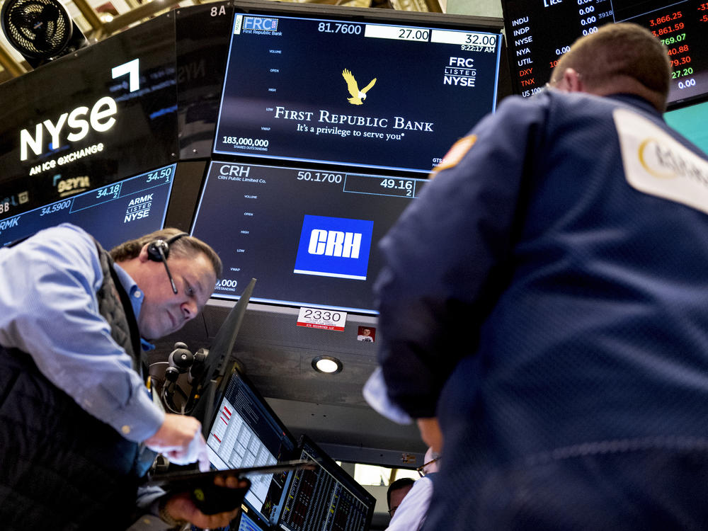 Traders work on the floor at the New York Stock Exchange in New York on March 13.
