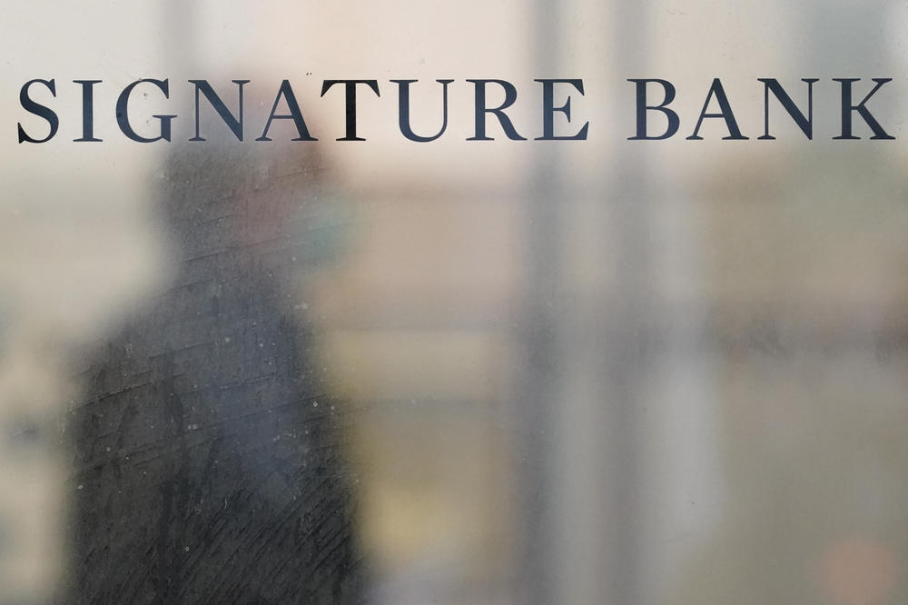 A sign is displayed at a branch of Signature Bank in New York on March 13.