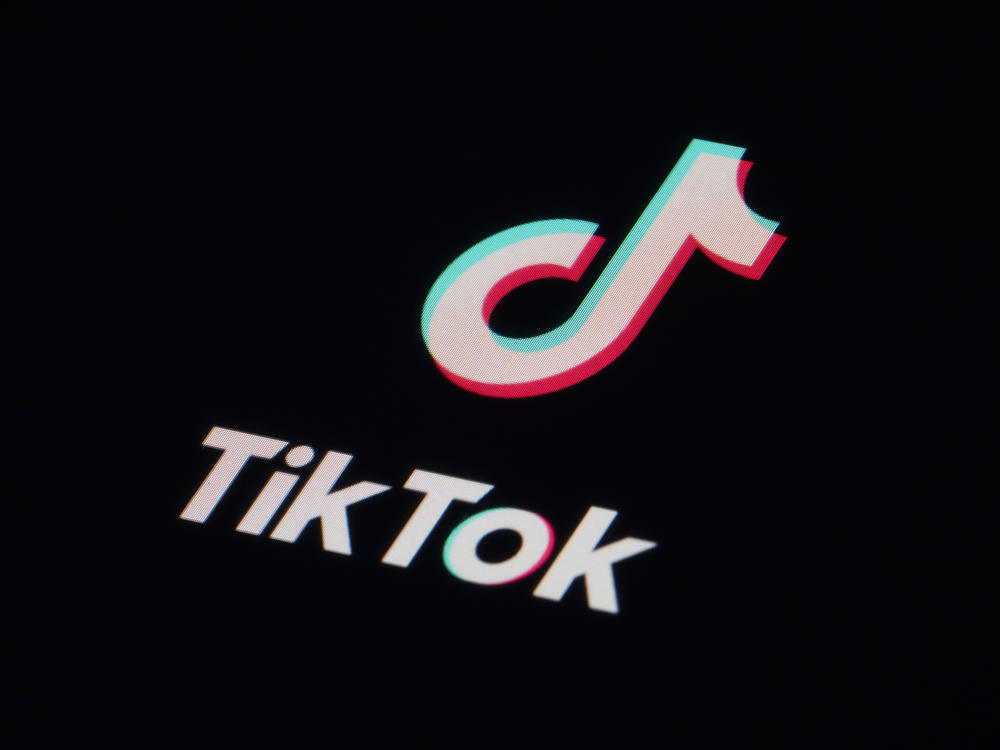 The icon for the video sharing TikTok app is seen on a smartphone on Feb. 28. British authorities said Thursday that they are banning the Chinese-owned app from government mobile phones on security grounds.