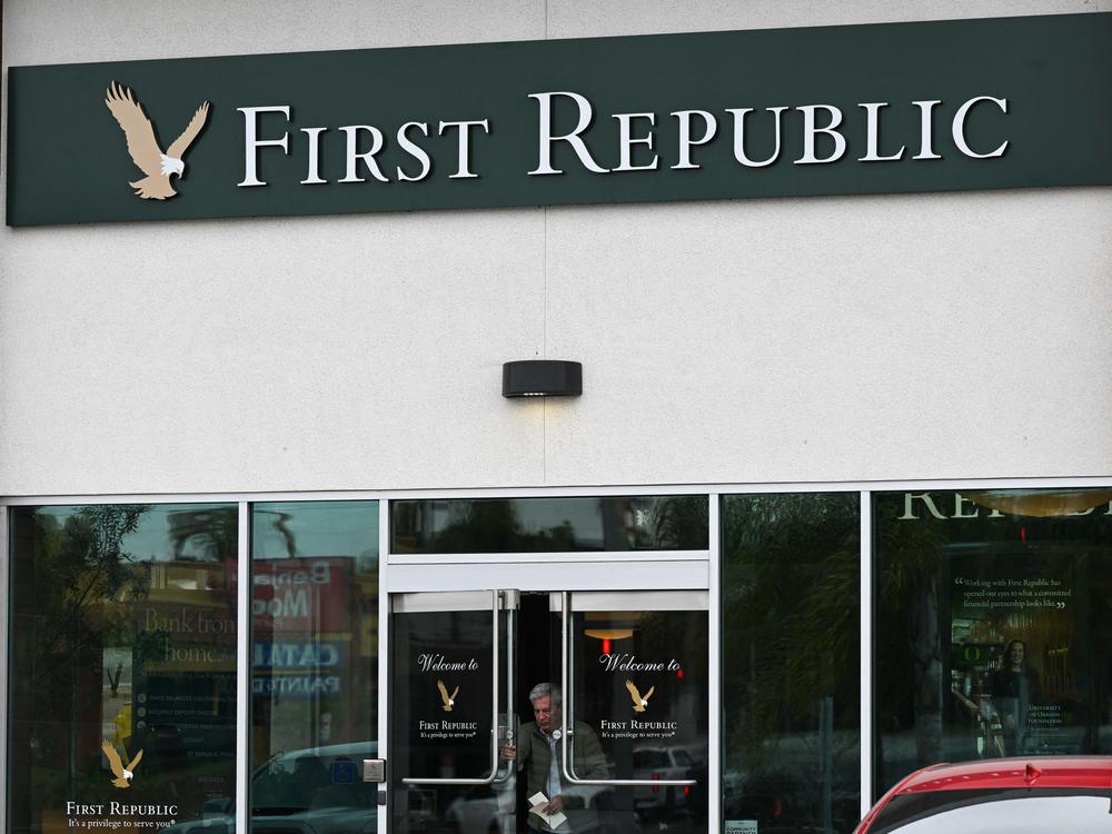 A customer exits a First Republic Bank branch in Manhattan Beach, Calif., on March 13, 2023. The midsized lender was rescued by a group of top banks after suffering an exodus of depositors following the collapse of two U.S. banks.