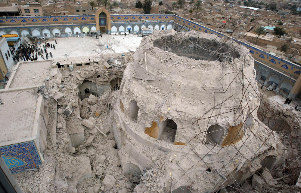 Feb. 22, 2006: Iraqis gather at the ruins of the al-Askari mosque in Samarra, Iraq.