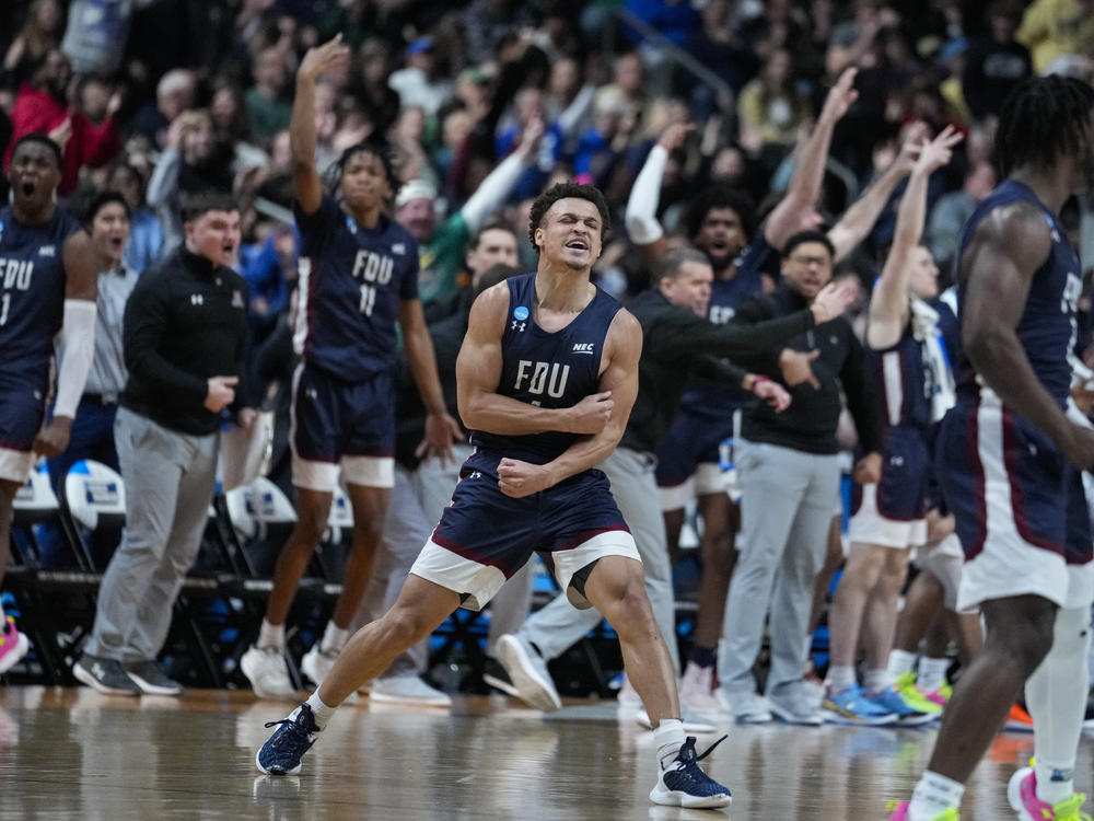 Fairleigh Dickinson guard Grant Singleton, center, celebrates after a basket against Purdue in the second half of a first-round college basketball game in the men's NCAA Tournament in Columbus, Ohio, on Friday. FDU would go on to take the win, upsetting top-seeded Purdue University.