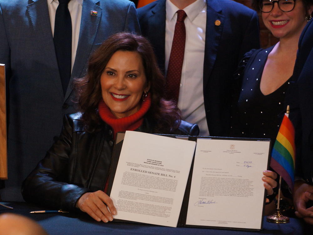 Michigan Gov. Gretchen Whitmer signs a law to include the rights of LGBTQ people in Michigan's Civil Rights law on Thursday, March 16, 2023, in Lansing, Mich.