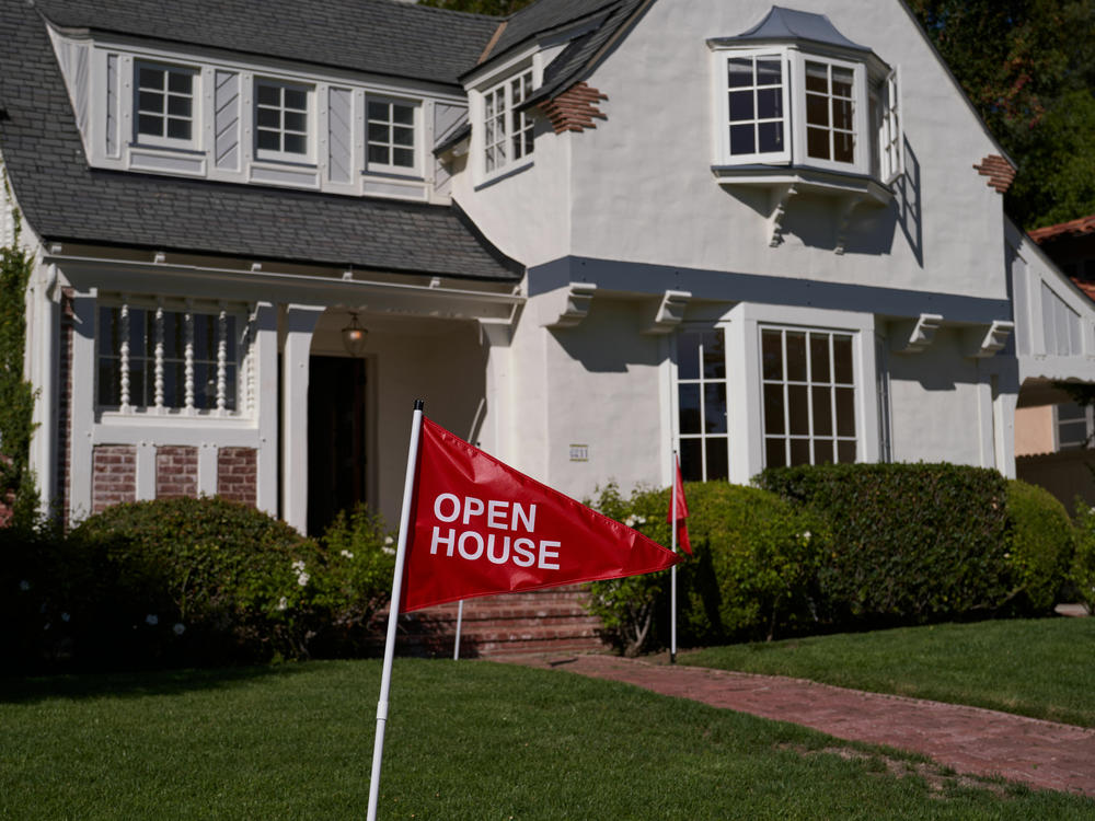 An 'open house' flag is displayed outside a single family home on September 22, 2022 in Los Angeles, California. The U.S. housing market is seeing a slow down in home sales due to the Federal Reserve raising mortgage interest rates to help fight inflation.