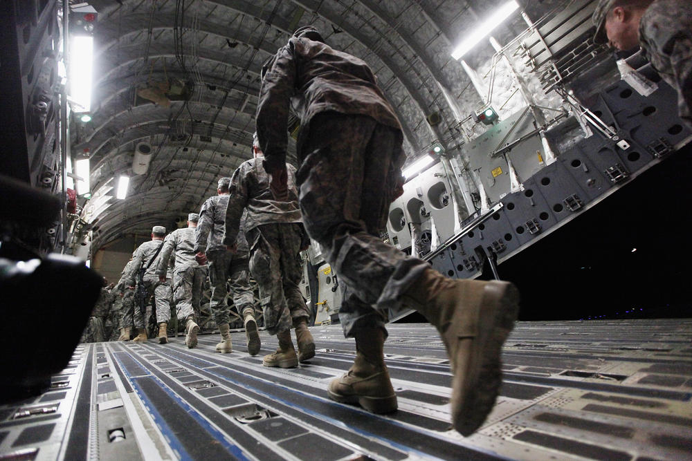 Dec. 17, 2011: Soldiers from the 3rd Brigade's 1st Cavalry Division board a C-17 transport plane to depart from Iraq at Camp Adder, now known as Imam Ali Base, near Nasiriyah, Iraq.