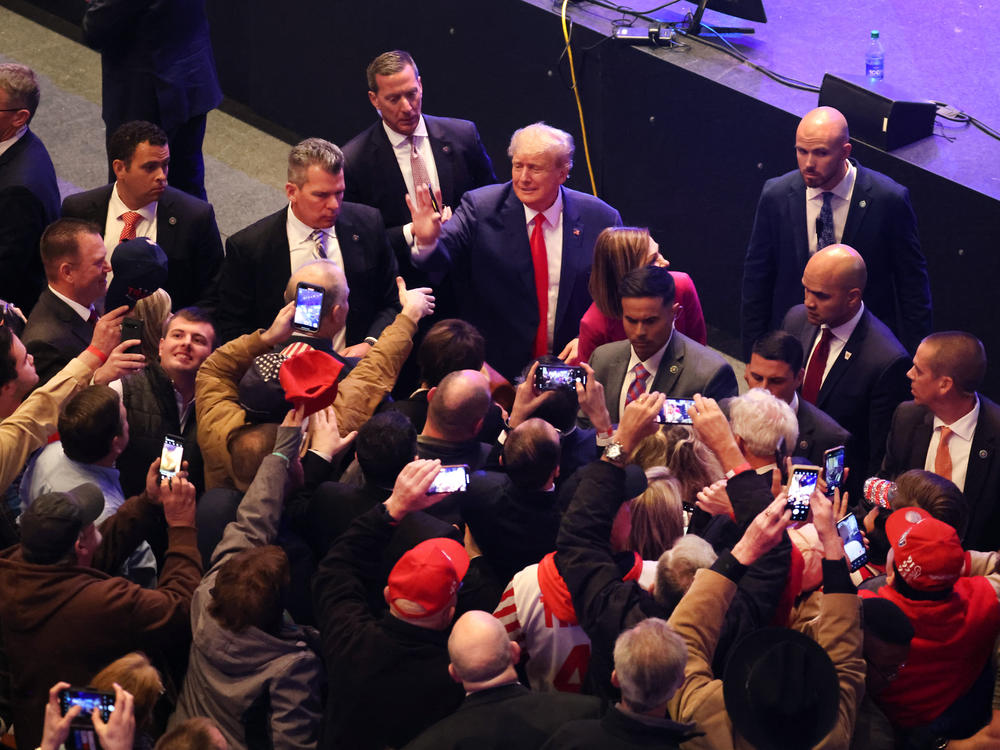 Former President Donald Trump greets guests following an event on March 13, 2023 in Davenport, Iowa. Trump's visit followed those by potential challengers for the GOP presidential nomination, Florida Gov. Ron DeSantis and former U.N. Ambassador Nikki Haley.