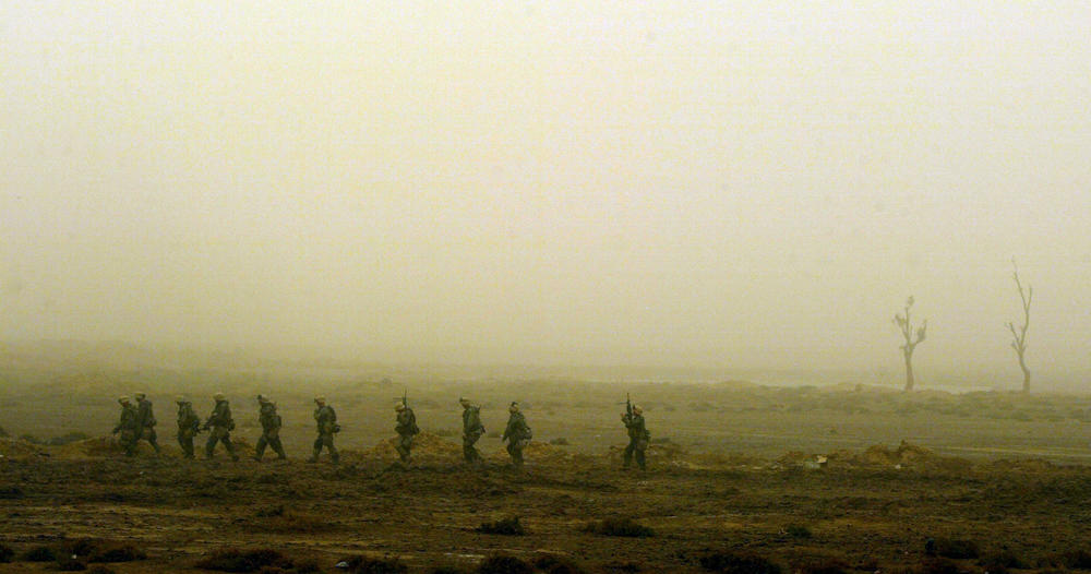 March 26, 2003: U.S. Marines from Task Force Tarawa search for Iraqi troops in the southern Iraqi city of Nasiriyah. As night falls, the Marines are on alert for a counter attack from Iraqi troops.