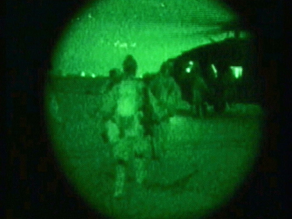 April 1, 2003: In this handout image from night-scope video, U.S. military personnel carry U.S. Pfc. Jessica Lynch off of a helicopter at an undisclosed location in Iraq. Lynch was rescued from a hospital in Nasiriyah, Iraq. Lynch had been missing since March 23, when she and members of her unit, the U.S. Army's 507th Maintenance Company, were ambushed by Iraqi forces.