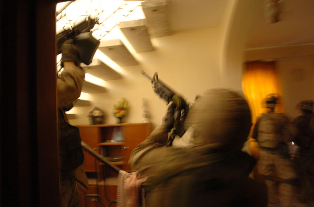 Nov. 10, 2004: U.S. Marines search houses for insurgents in Fallujah, Iraq.