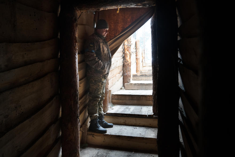 A member of Ukraine's military stands at the entrance to a vast underground bunker in the Volyn region, in Western Ukraine.