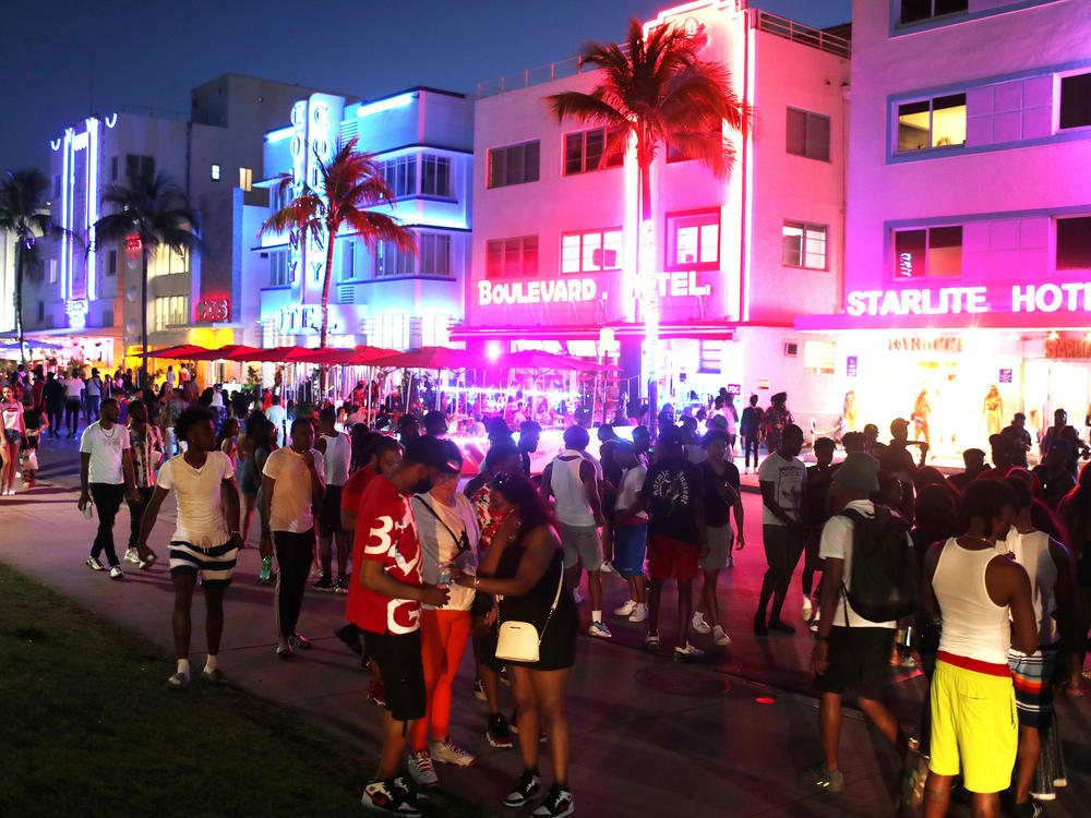 Spring break crowds, seen in 2021 in Miami Beach, Fla., are once again making the annual pilgrimage to the South Florida destination. Concerned about managing unruly crowds, city officials this year imposed an overnight curfew for Sunday night.