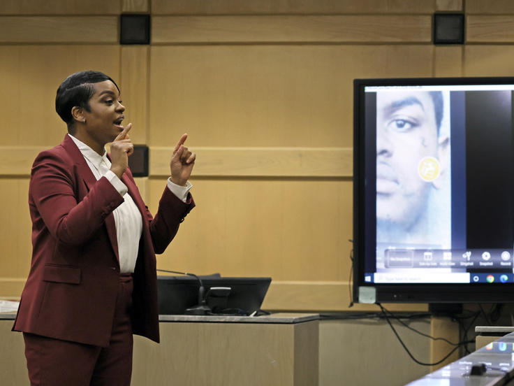 Assistant State Attorney Pascale Achille gives her closing rebuttal with a photograph of suspected shooting accomplice Dedrick Williams displayed on a courtroom monitor March 8 in the XXXTentacion murder trial at the Broward County Courthouse in Fort Lauderdale, Fla.