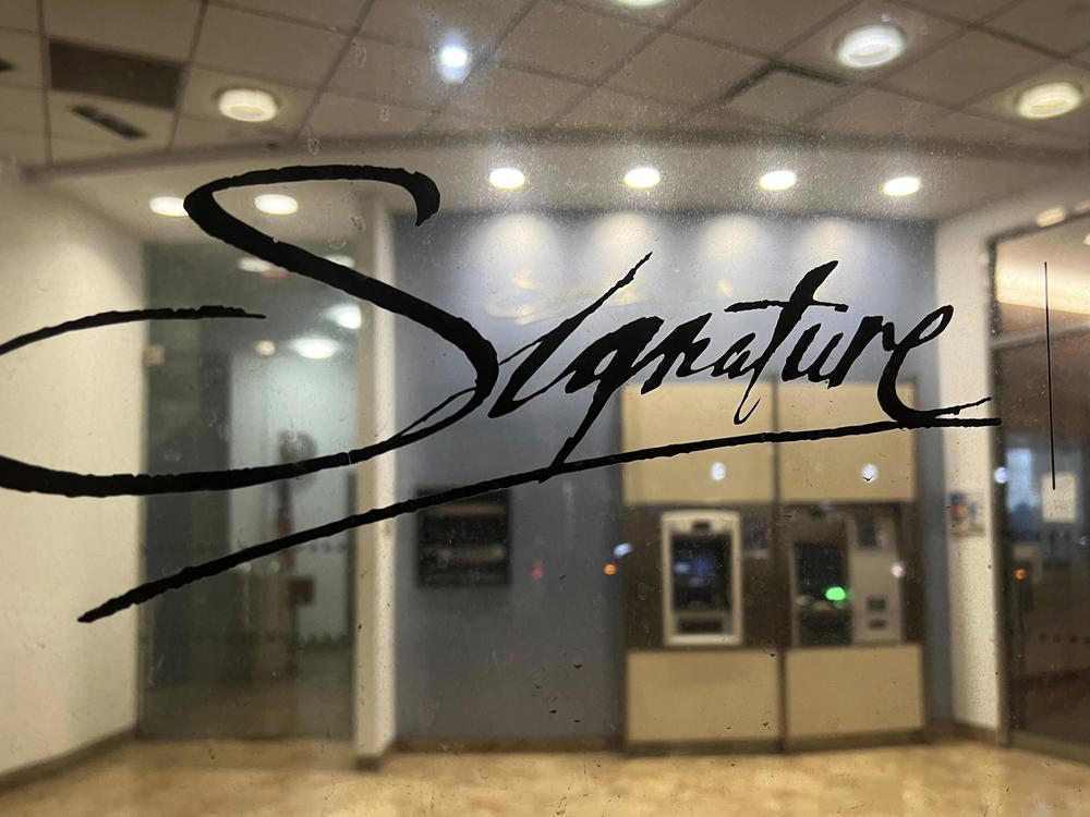 A branch of Signature Bank is photographed, late Sunday, March 12, 2023, in New York. New York Community Bank has agreed to buy a significant chunk of the failed Signature Bank in a $2.7 billion deal, the Federal Deposit Insurance Corp., said late Sunday, March 19, 2023.