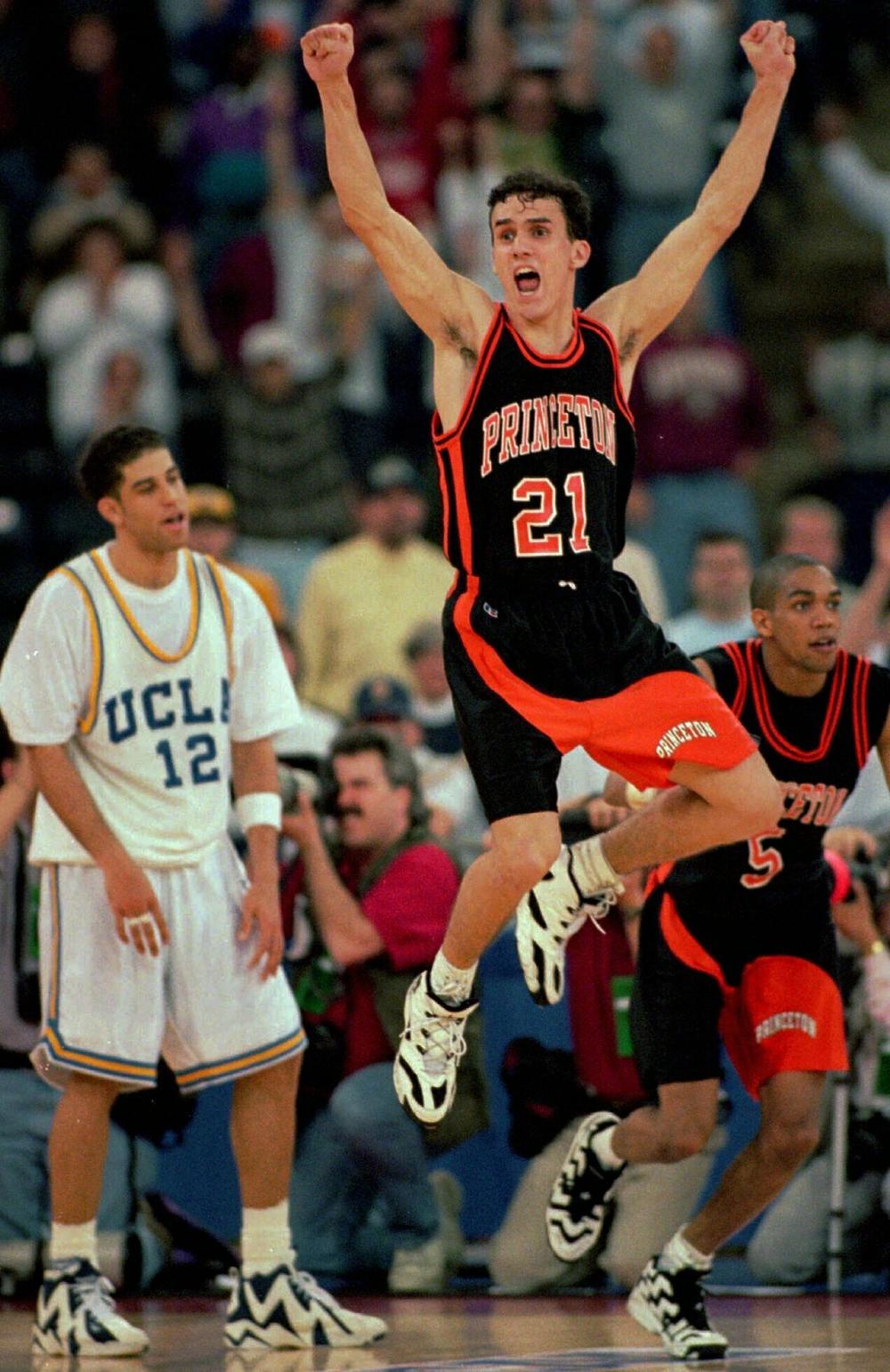 March 14, 1996: Princeton guard Mitch Henderson leaps to celebrate the Tigers' victory over UCLA as Bruins guard Toby Bailey, left, looks on in the first round of the NCAA tournament. Henderson, now a coach, has Princeton in the Sweet 16.