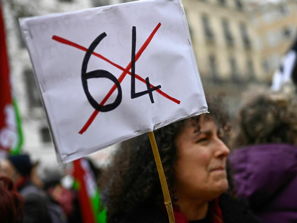 A protester participates in a demonstration in Marseille on March 18 after the French government pushed a pensions reform through parliament without a vote.