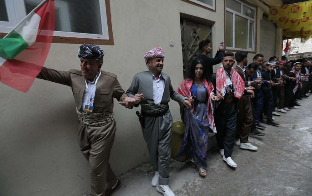 Iraqi Kurds celebrate the Persian New Year, Nowruz, in the town of Akra in Iraq's northern autonomous Kurdish region, on March 20, 2023.