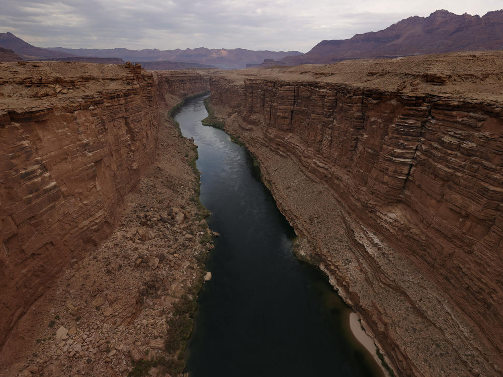 The Colorado River flows by the historic Navajo Bridge on June 23, 2021 in Marble Canyon, Ariz.