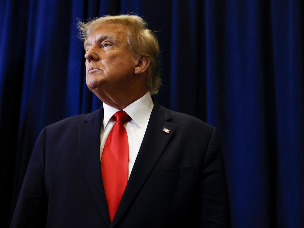 Former President Donald Trump speaks to reporters before his speech at the annual Conservative Political Action Conference (CPAC) at Gaylord National Resort & Convention Center on March 4 in National Harbor, Md.