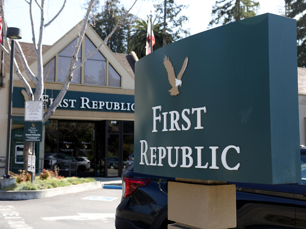 The First Republic Bank sign is shown in Oakland, Calif., in front of one of the lender's offices on March 16, 2023. First Republic shares continued to fall on Monday amid concerns about its financial health.