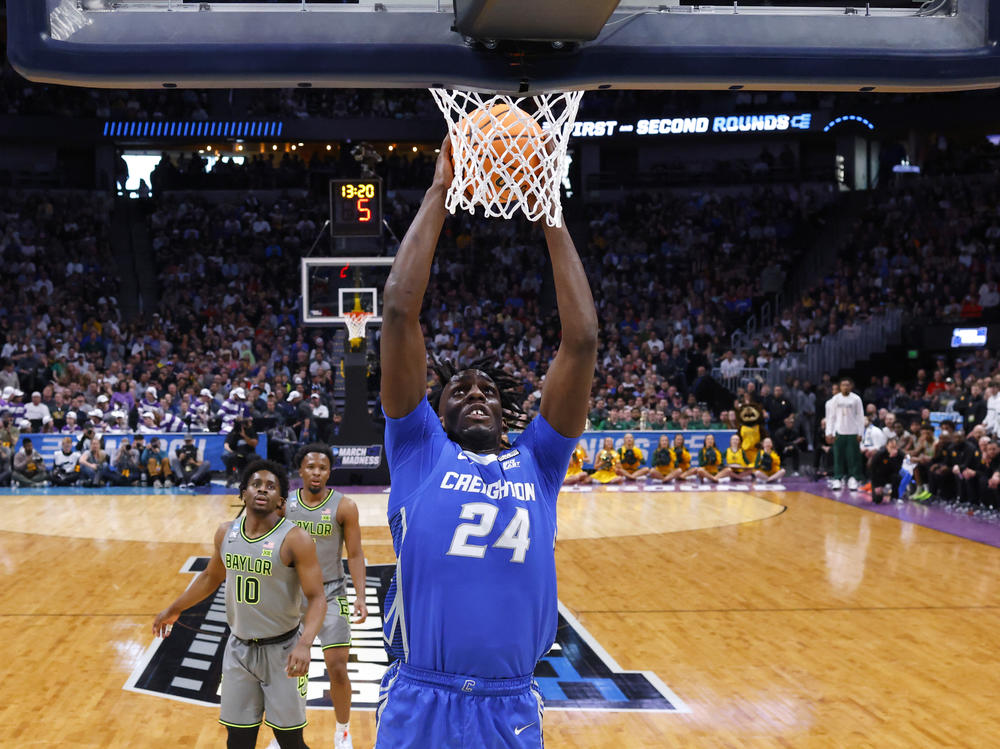 Arthur Kaluma #24 of the Creighton Bluejays dunks during the second half against the Baylor Bears at Ball Arena on Sunday in Denver.