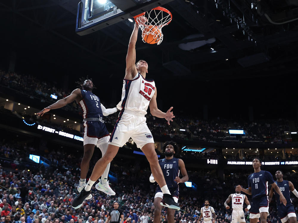 Vladislav Goldin of the Florida Atlantic Owls dunks in front of Demetre Roberts of the Fairleigh Dickinson Knights on Sunday in Columbus, Ohio. FAU dispatched the Cinderella Knights from the 2023 NCAA tournament.