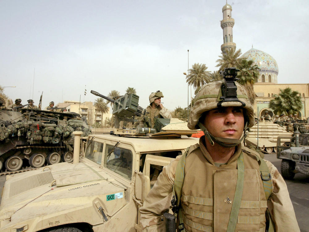 U.S. Marines take up positions in the area around the Palestine hotel in the center of Baghdad, April 9, 2003.