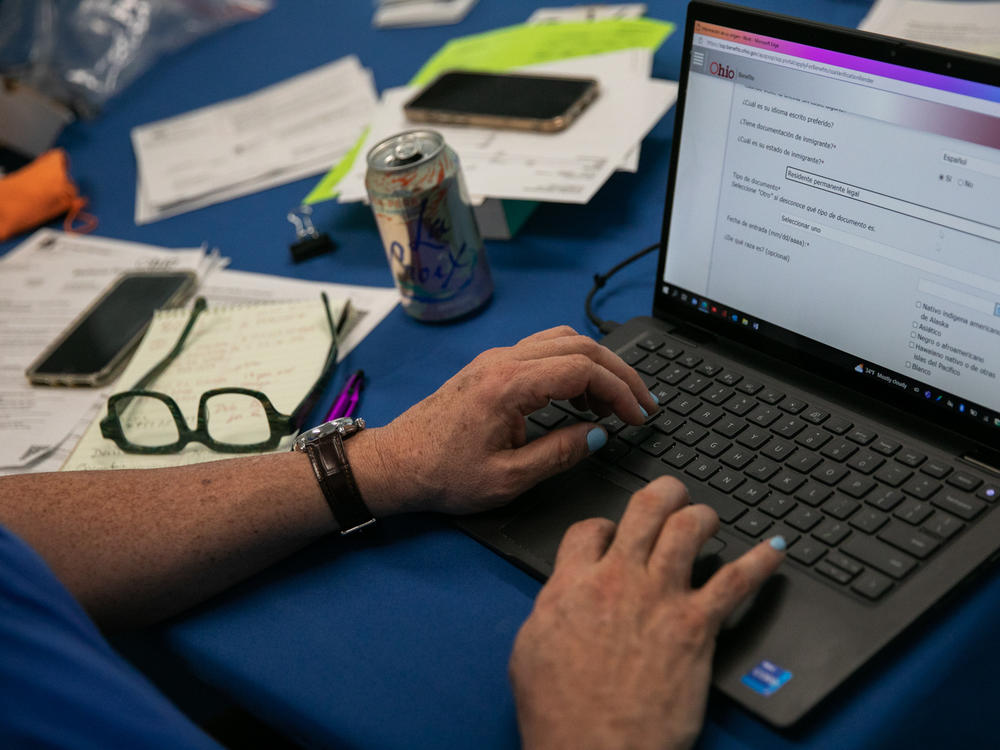 Samuel Camacho, a health insurance navigator with the Universal Health Care Action Network of Ohio, assists people in enrolling for or renewing Medicaid.