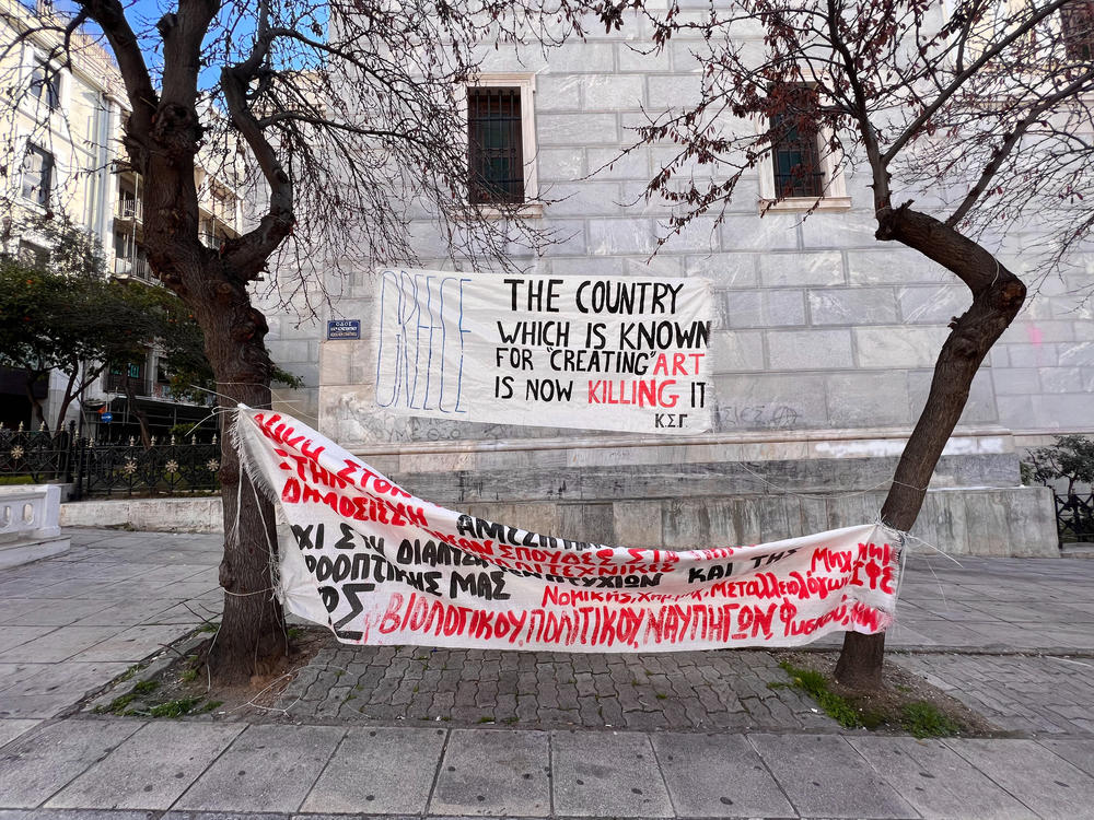 Students and young artists have been occupying the National Theatre of Greece in downtown Athens for more than a month. Banners hang outside, including one that reads: 