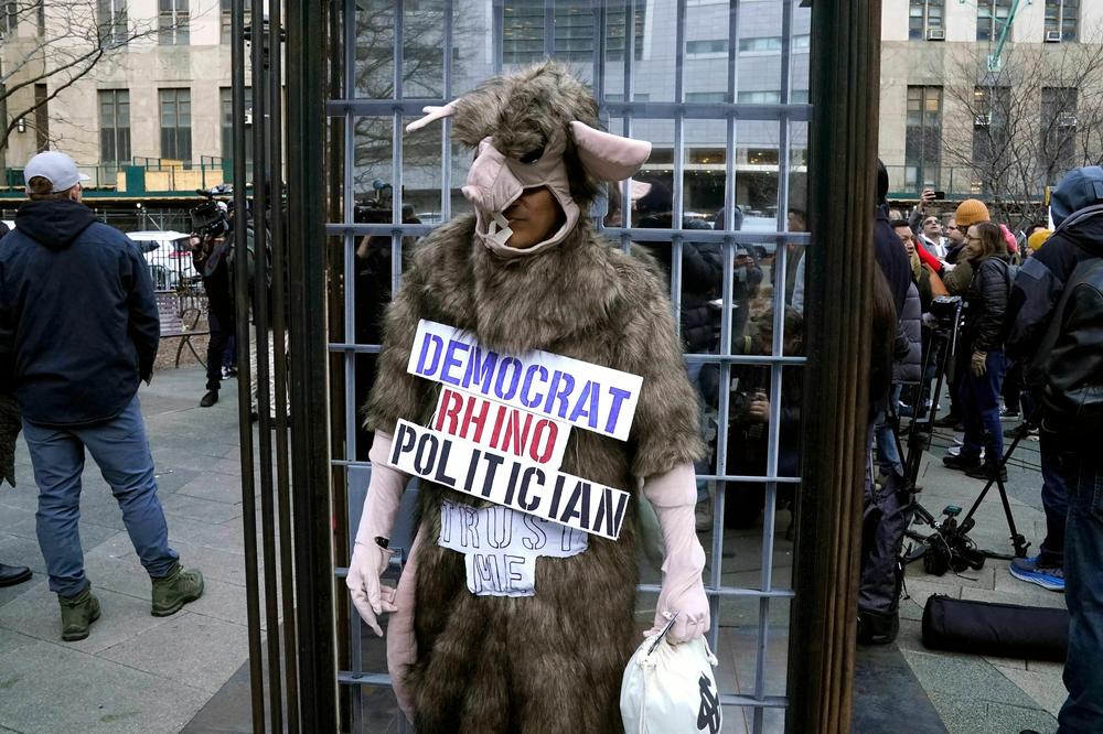 Members of the New York Young Republicans and the Long Island Loud Majority hold a rally for former Trump outside the offices of Alvin Bragg.
