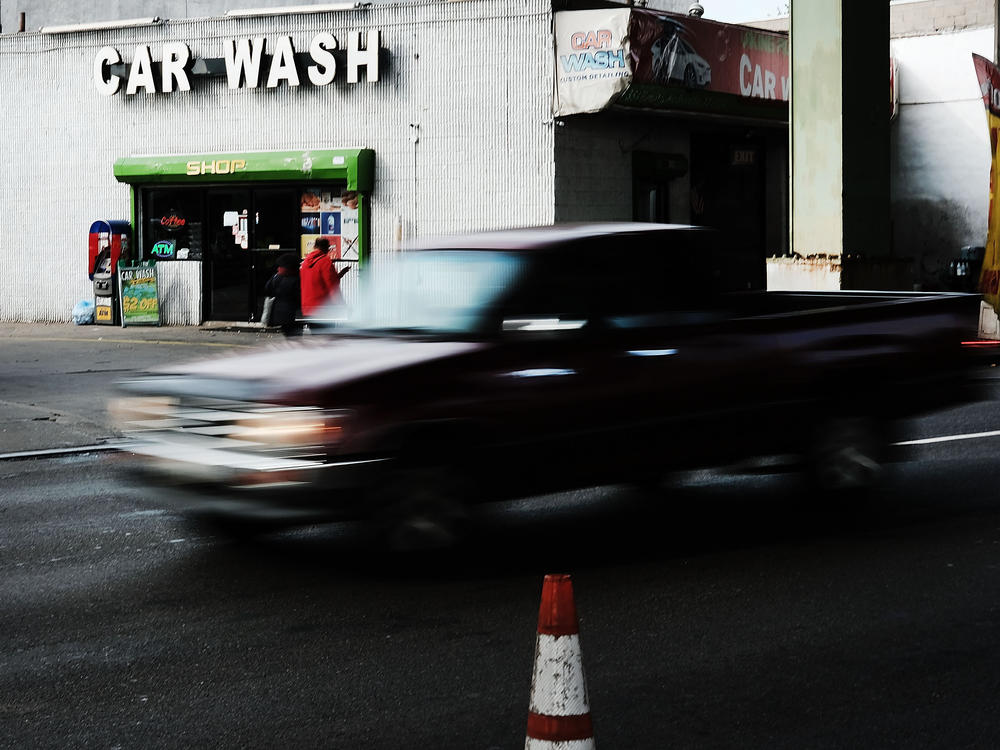 A truck drives by a car wash in New York City. Public officials are warning Jewish customers of price gouging at local car washes ahead of Passover.