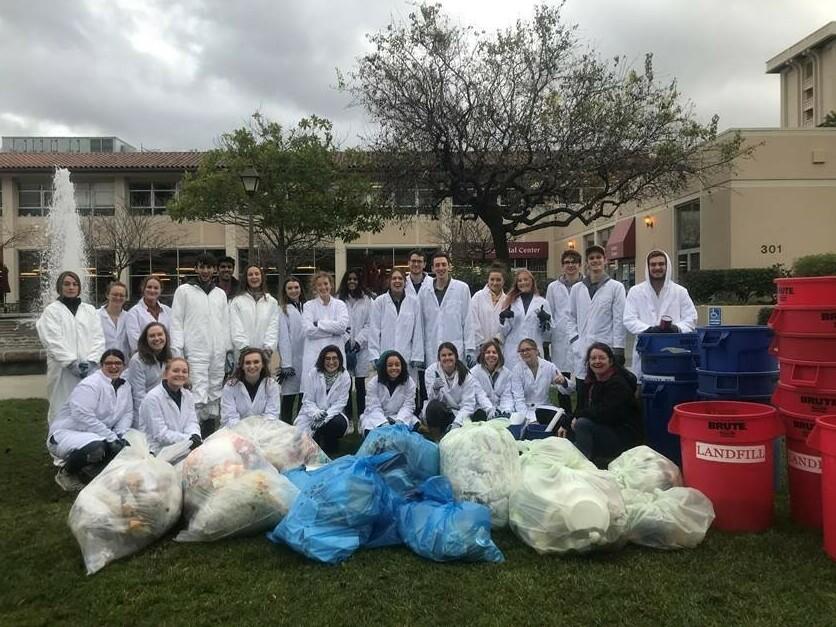 Professor Stephanie Hughes and students categorizing various types of waste in January 2020.