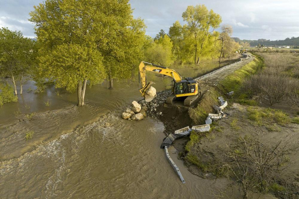 Heavy storms caused a levee to break in Pajaro, Calif., flooding nearby homes. The parade of winter storms has tested the state's infrastructure.