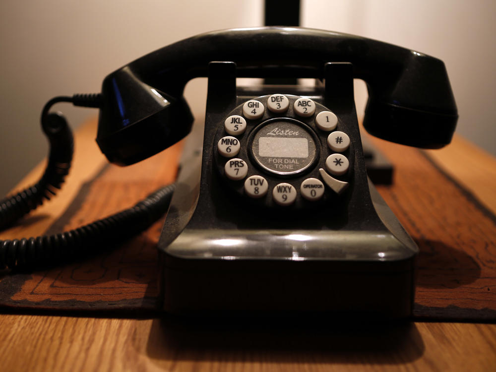 This Wednesday, April 14, 2016, file photo, shows a push-button landline telephone, in Whitefield, Maine.