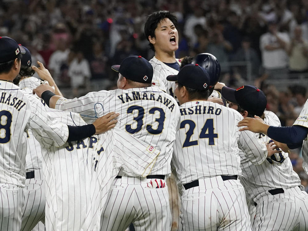 Japan pitcher Shohei Ohtani, center, celebrates after defeating the United States at the World Baseball Classic final game, Tuesday, March 21, 2023, in Miami.