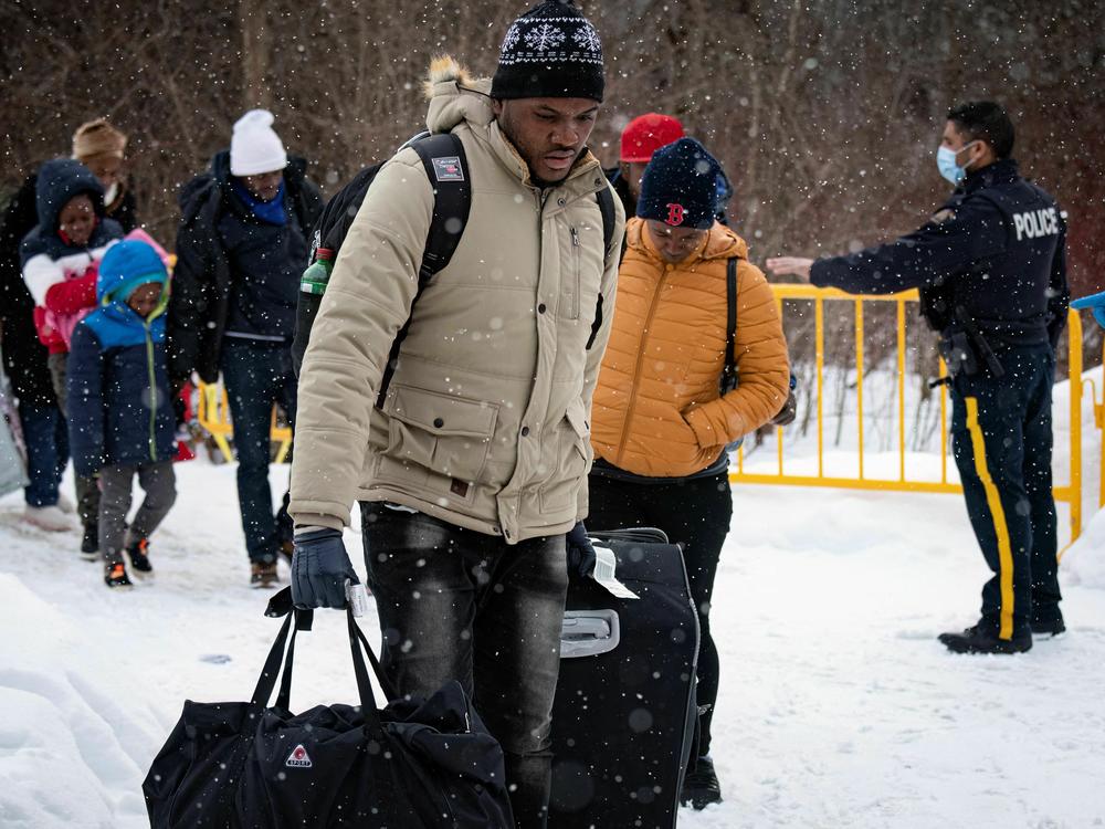 Migrants from Haiti, Venezuela, Nigeria and other countries arrive at the Roxham Road border crossing in Quebec, on March 2, 2023.
