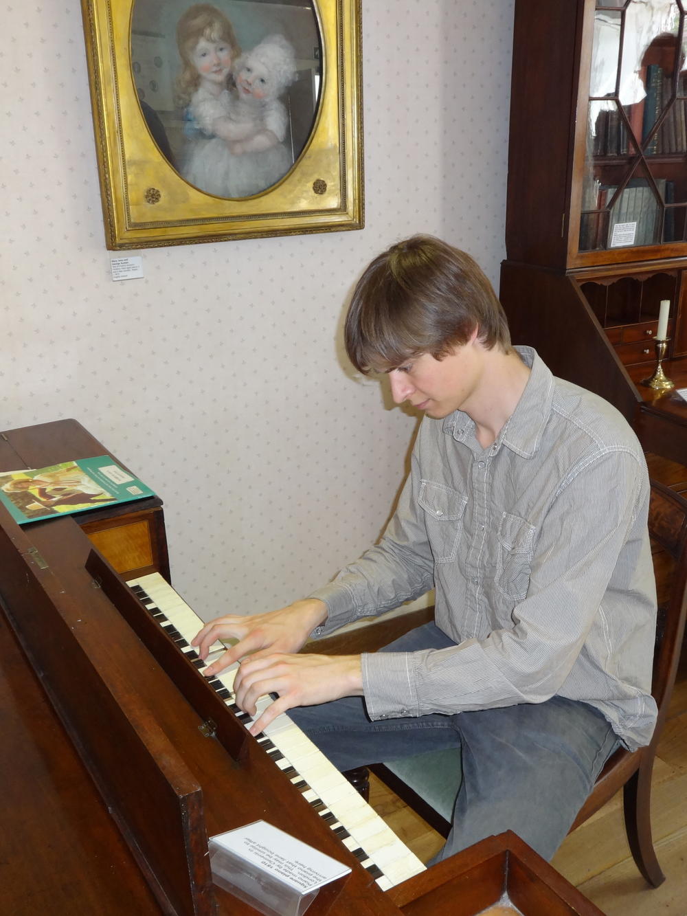 Tristan Begg plays the piano at Jane Austen's house in 2014.