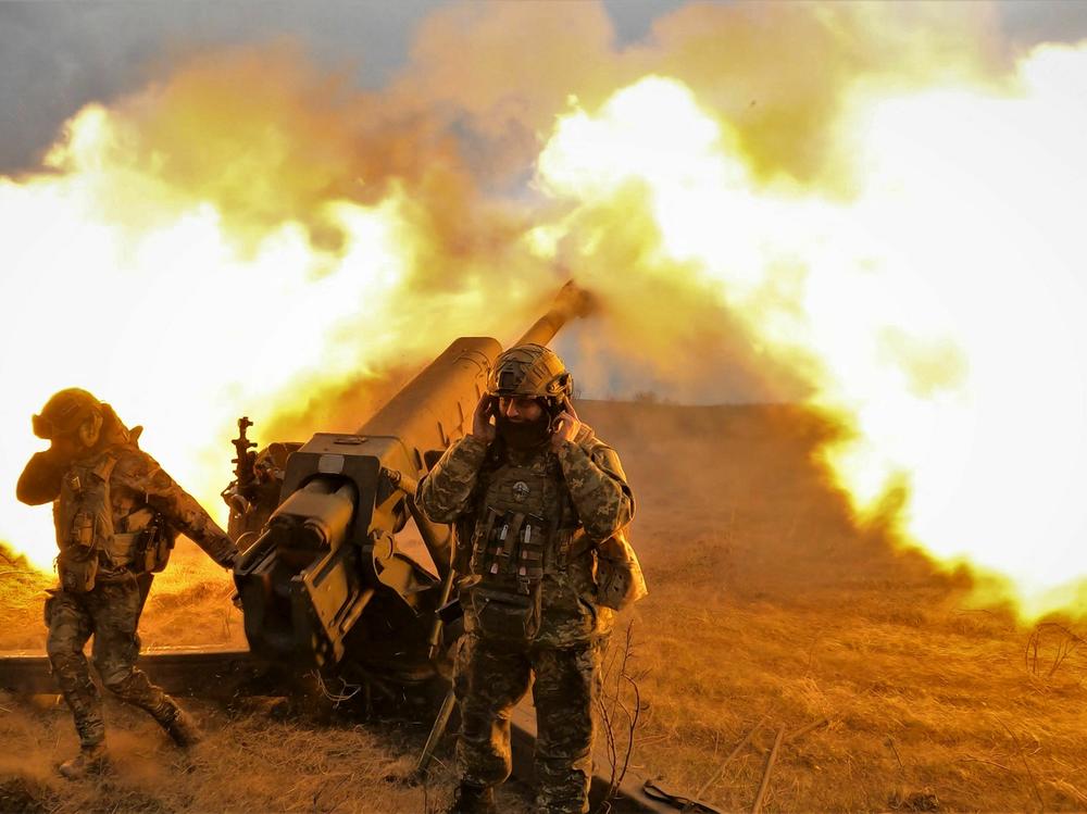 Ukrainian servicemen fire with a D-30 howitzer at Russian positions near Bakhmut, eastern Ukraine, on Tuesday.