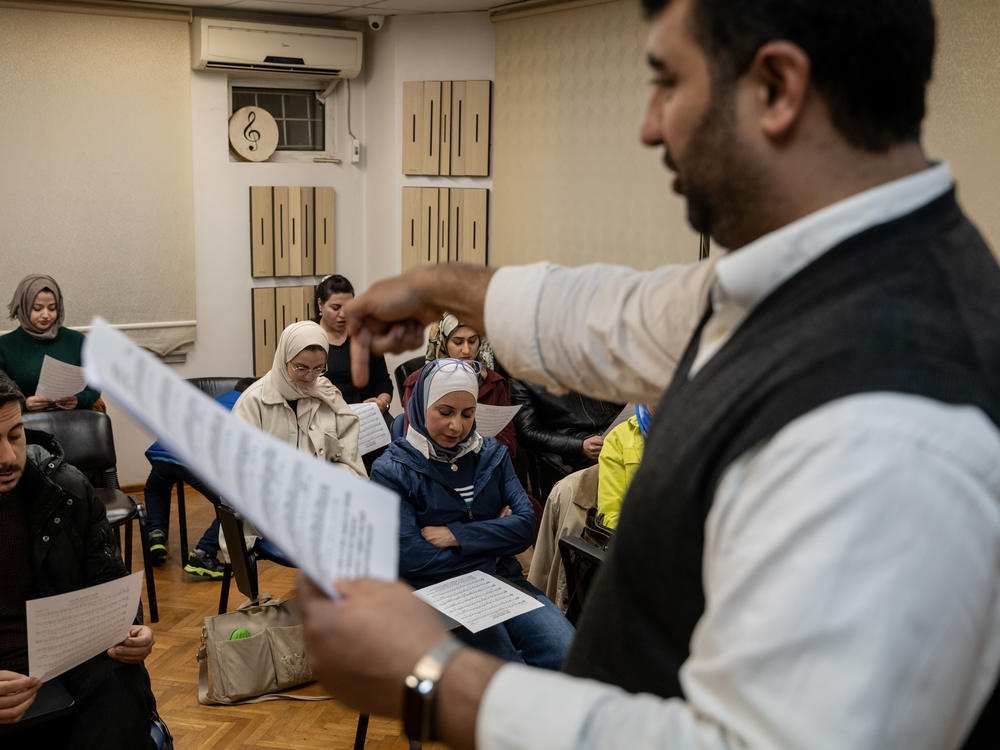 Ibrahim Muslimani, 30, speaks to a class about a piece of music blending different eras and languages at the Nefes Foundation for Arts and Culture, which he founded in 2016, in Gaziantep, Turkey, on Nov. 22, 2022.