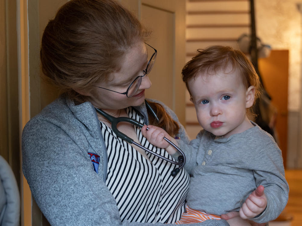 Dr. Leah Rethy, an internal medicine resident with Penn Medicine, holds her 17 month-old son, Peter.
