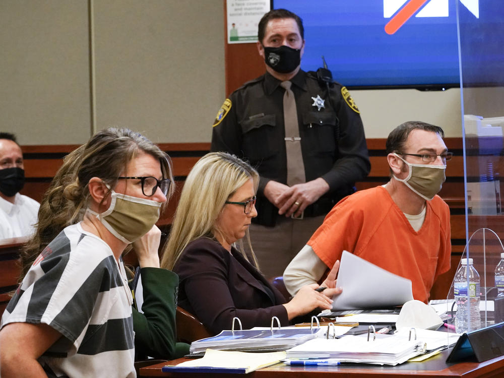 Jennifer Crumbley (left) and James Crumbley (right), the parents of Ethan Crumbley, a teenager accused of killing four students in a shooting at Oxford High School in Oxford, Mich., appear in court in Rochester Hills, Mich., on Feb. 8, 2022. Jennifer and James Crumbley can face trial for involuntary manslaughter, the state appeals court said Thursday.