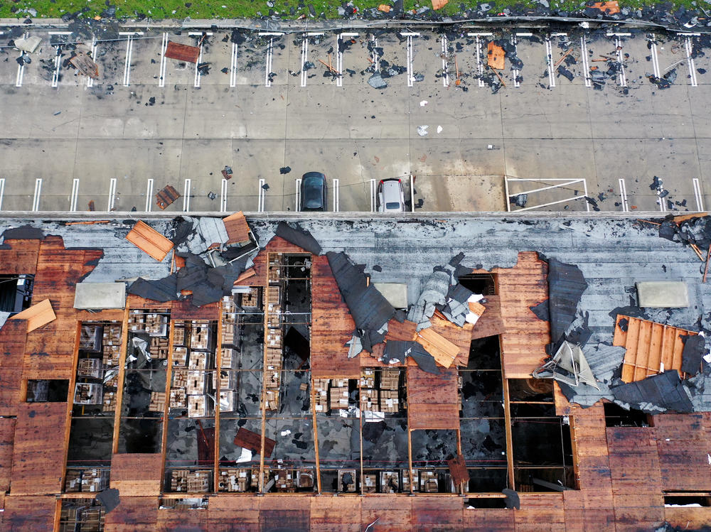 An aerial view of roof damage after a rare confirmed tornado touched down and ripped up building roofs in a Los Angeles suburb on Wednesday in Montebello, Calif.